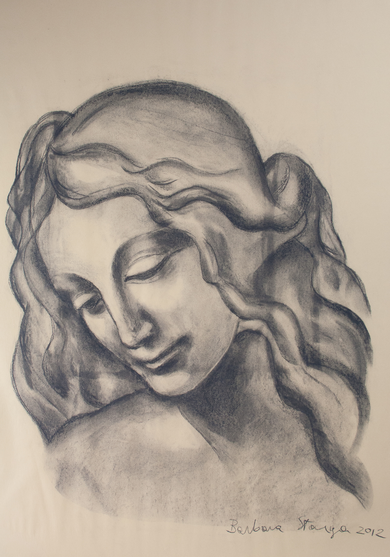 Charcoal drawing on paper representing a young lady with a dreaming expression.
