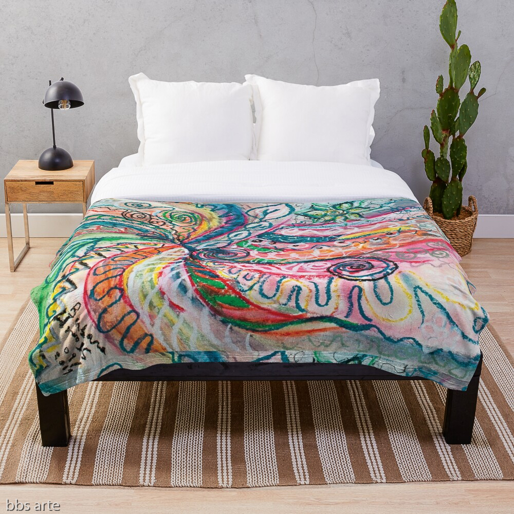 throw blanket with abstract concentric nature creation in tones of pink, blue, green, orange, black and white with curls and shapes of nature