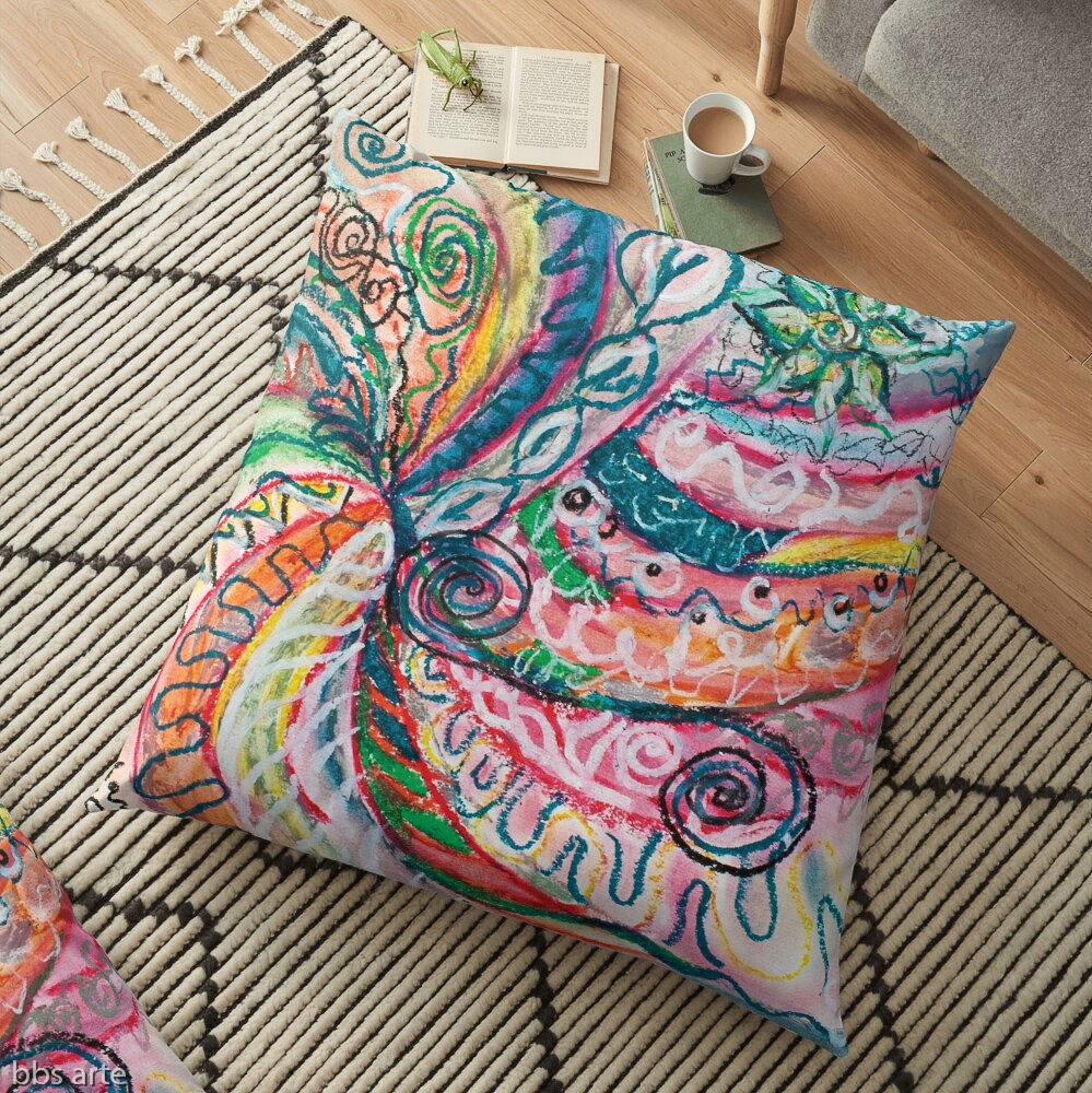floor pillow with abstract concentric nature design in tones of pink, blue, green, orange, black and white with curls and shapes of nature