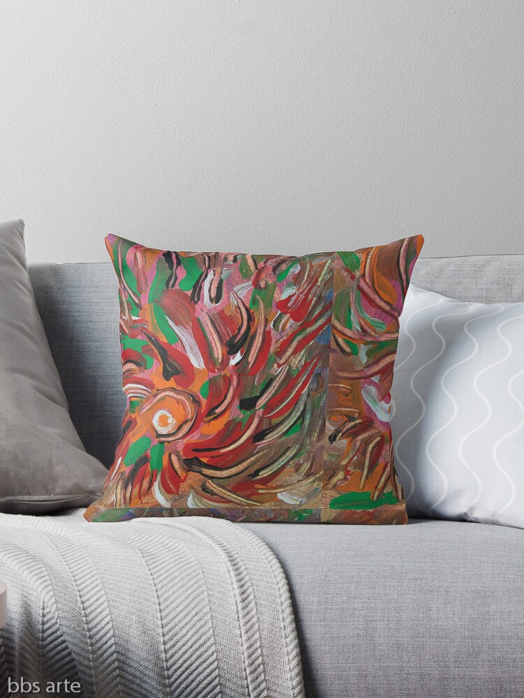 throw pillow with flaming vortex pattern in tones of red, white, green, orange, yellow, brown and black