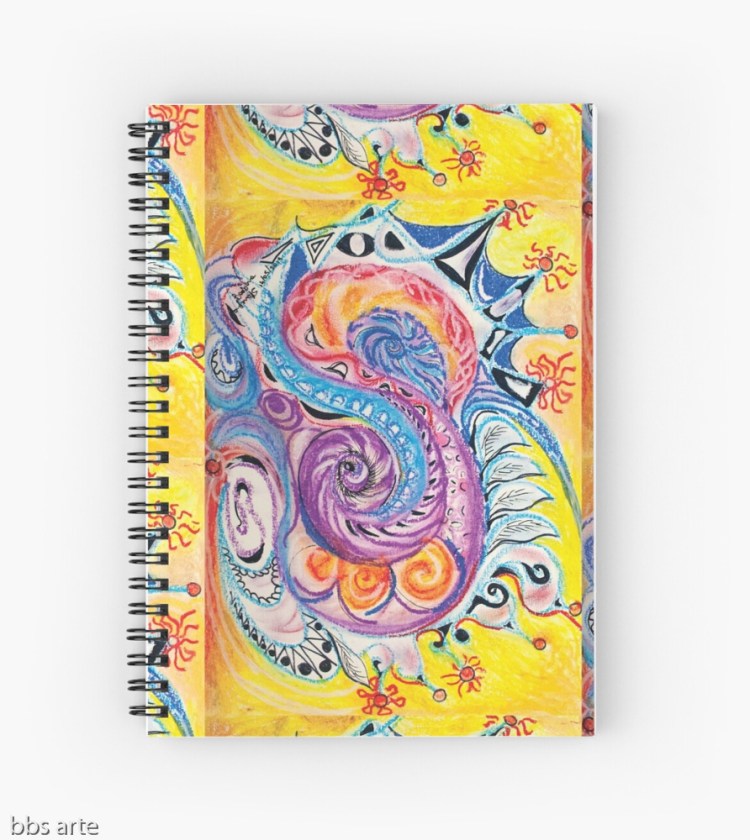 spiral notebook with bright multicolored abstract design in red, white, orange, pink, black, blue, light blue and purple tones with circles and concentric shapes, on yellow background, with nuances